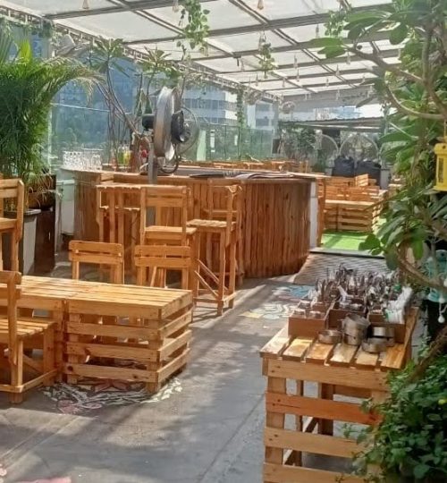 Rustic Wood Furniture with Bar Area and Greenery